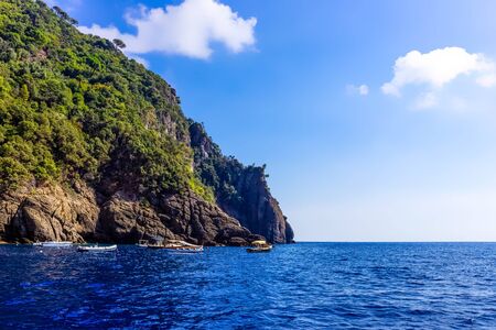 The sea view of green hills near harbor of Portofino at Italy