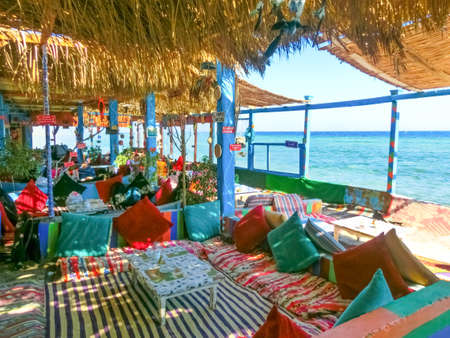 Dahab, Egypt - February 17, 2020: The outdoor cafe or lounge and relax area on red sea beach at Dahab blue Holeのeditorial素材