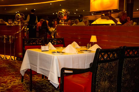 Willemstad, Curacao, Netherlands - December 5, 2019: The Grande Restaurant and tables with dishes at luxury Holland America cruise shipのeditorial素材