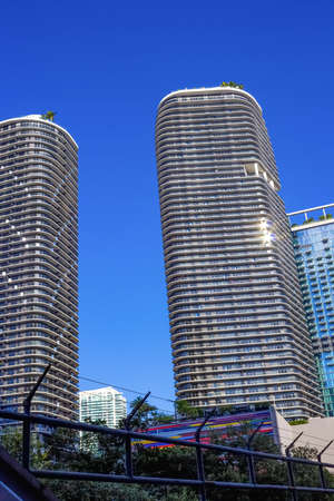 Miami, USA - November 30, 2019: Downtown Miami cityscape view with condos and office buildings against blue sky.のeditorial素材
