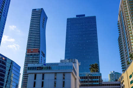 Miami, USA - November 30, 2019: Downtown Miami cityscape view with condos and office buildings against blue sky.のeditorial素材
