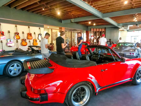 Miami, United States of America - November 30, 2019: Cars and guitars at Walt Grace Vintage Guitars...