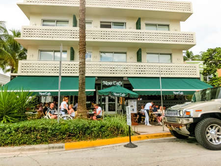 Miami, United States of America - November 30, 2019: Hotel and cafe at Ocean drive in Miami Beach, Florida. Art Deco architecture in South Beach is one of the main tourist attractions in Miami.のeditorial素材