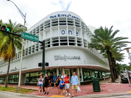 Miami, United States of America - November 30, 2019: Street scene with traffic and famous hotels at Collins Avenue in Miami Beachのeditorial素材