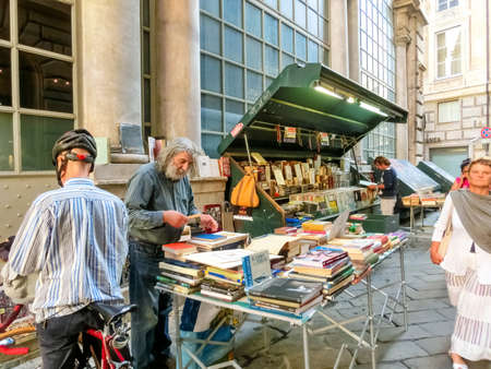 Genoa, Liguria, Italy - September 11, 2019: The old man is selling books outdoors in Genoa, Liguria, Italy on September 11, 2019のeditorial素材