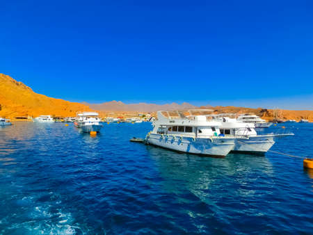 Sharm El Sheikh, Egypt - February 16, 2020: Pleasure yachts in the port for cruise at Ras Mohammed...