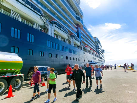 Puerto Limon, Costa Rica - December 9, 2019: The people going near Holland America cruise ship Eurodam docked at Puerto Limon in Costa Rica.のeditorial素材