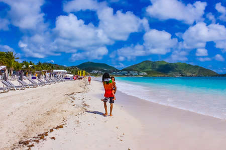 Philipsburg, Sint Maarten, Netherlands - May 14, 2016: The chairs and umbrellas on Caribbean tropical beachのeditorial素材