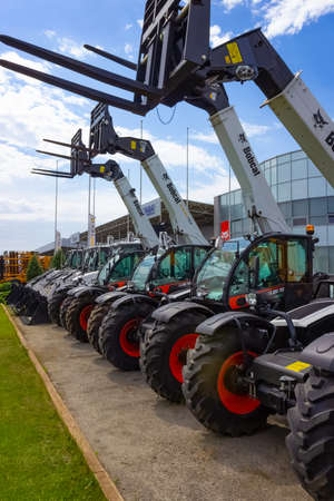 Kyiv, Ukraine - June 16, 2020: Skid steer loader Bobcat at road at Kyiv, Ukraine on June 16, 2020