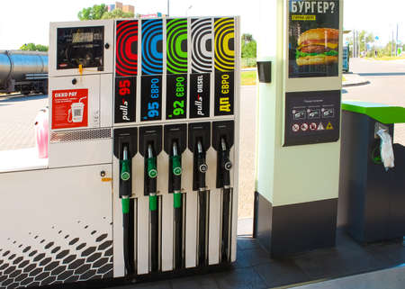 Kyiv, Ukraine - June 28, 2020: Filling nozzles at OKKO gas station at sunny day at Kyiv, Ukraine on June 28, 2020.のeditorial素材