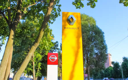 Kyiv, Ukraine - July 29, 2020: Renault and Nissan dealership signs against blue sky. Renault is known for its role in motor sport, particularly rallying, Formula 1 and Formula E.のeditorial素材