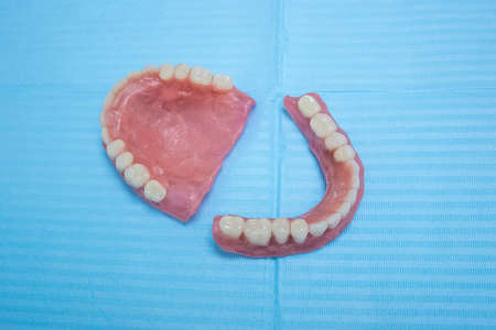 Removable dentures flexible, devoid of nylon, hypoallergenic exempt from monomer on blue background