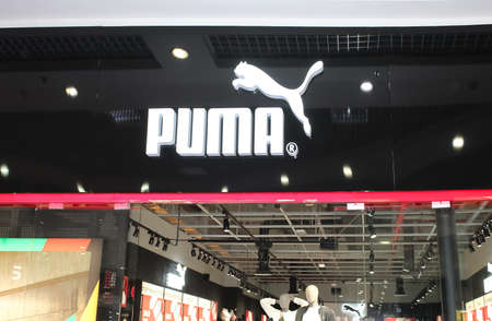 Kiyv, Ukraine - August 2, 2020: Puma logo on a facade of store. Puma is a major german multinational company that produces athletic, casual footwear, sportswear, headquartered in Bavaria, Germanyのeditorial素材