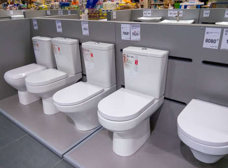 Kyiv, Ukraine - August 16, 2020: Rows of modern toilet bowls in a store EpiCentre at Kyiv, Ukraine on August 16, 2020.のeditorial素材