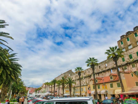 Split, Croatia - May 08, 2014: The people resting on wide promenade in old city in Split, Croatia on a cloudy day on May 08, 2014. It is well preserved and important popular touristic attraction of Dalmatiaのeditorial素材
