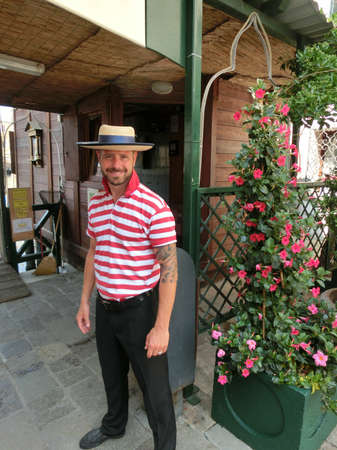 Venice, Italy - June 06, 2015: View one of venetian gondolier at Venice, Italy on June 06, 2015.のeditorial素材