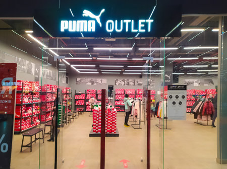 Kiyv, Ukraine - December 5, 2020: Puma logo on a facade of store. Puma is a major german multinational company that produces athletic, casual footwear, sportswear, headquartered in Bavaria, Germanyのeditorial素材
