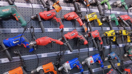 Kyiv, Ukraine - August 15, 2020: Construction market. Shelves with hand electric power tools - electric drills and hammer drills at Kyiv, Ukraine on August 15, 2020.のeditorial素材