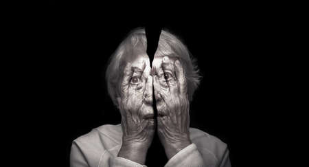 Old aging scared woman on black background. Collage. Concept of horror.の写真素材