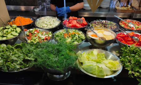Food on the shelves in the self-service buffet with all inclusive in Turkey at abstract hotel or...