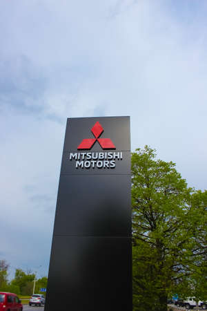 Kyiv, Ukraine - May 8, 2021: Logo of Mitsubishi Motors company. Mitsubishi Motors is the Japanese automotive manufacturer.のeditorial素材