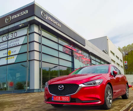 Kyiv, Ukraine - August 15, 2020: retail of Mazda logo on store front, Mazda is a japanese brand multinational company which currently produces automotiveのeditorial素材