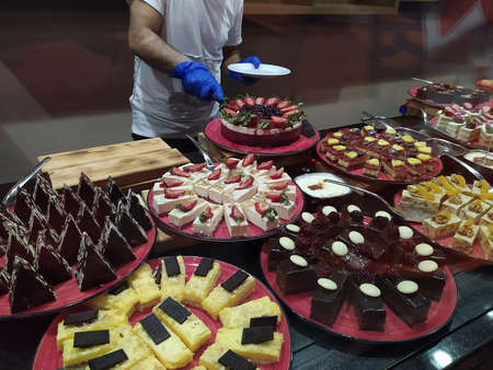 Food on the shelves in the self-service buffet with all inclusive in Turkey at abstract hotel or...