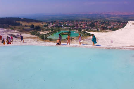 Pamukkale, Turkey - May 11, 2021: People at travertines in Turkey. Calcite cliff of Pamukkale at sunny dayのeditorial素材