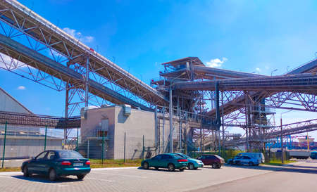 Odessa, Ukraine, South - July 21, 2021: Loading corn for storage at a grain elevator and blue skyのeditorial素材