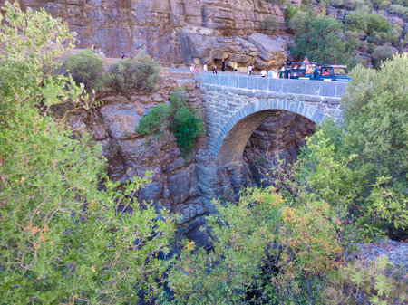 Antalya, Turkey - September 15, 2021: Green trees and antique bridge at Kuzdere Canyon at Kemer Antalya Turkeyのeditorial素材