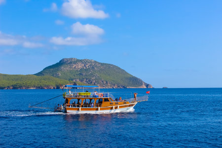 Antalya, Turkey - 15 Oktober 2020: People having fun at yacht on the shore of the cozy bay of Adrasan, near Antalya and Kemer, Turkey on the Mediterranean coast.のeditorial素材