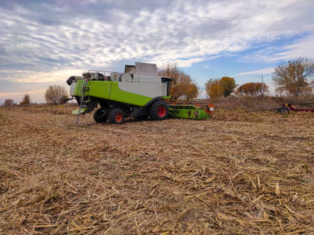 Harvest combain machinery in the autumn field