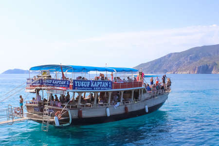 Antalya, Turkey - 15 Oktober 2020: People having fun at yacht on the shore of the cozy bay of Adrasan, near Antalya and Kemer, Turkey on the Mediterranean coast.のeditorial素材