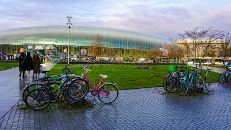 Strasbourg, Alsace, France - December 30, 2021: People going near beauty modern glasses railway station in Strasbourg in France.のeditorial素材