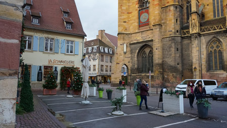 Colmar, France - December 30, 2021: People going at street with Christmas decorations at Colmar, in Alsace region, France.のeditorial素材