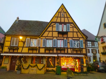 Eguisheim, Alsace, France - December 30, 2021: Morning scene in Eguisheim, a traditional village in the Alsace wine region of France, featuring a traditional house, now a wine degustation venueのeditorial素材