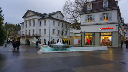 Baden-Baden, Germany - December 29, 2021: People going near historic buildings at the famous old...