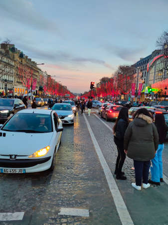 Paris, France - January 01, 2022: People going at Elysian Fields, Champs-Elesees in Paris. Paris - the capital of France. Main political, economic and cultural center of France.のeditorial素材