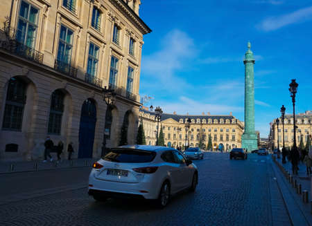 Paris, France - January 01, 2022: People going near Place Vendome, wich was laid out in 1702. The original Vendome Column at the center of the square was erected by Napoleon I.のeditorial素材