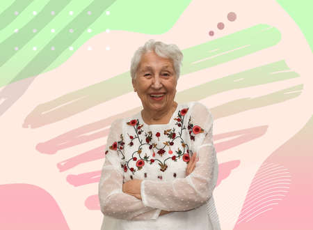 Old smiling woman with happy expression on her face on art studio background. Human emotions...