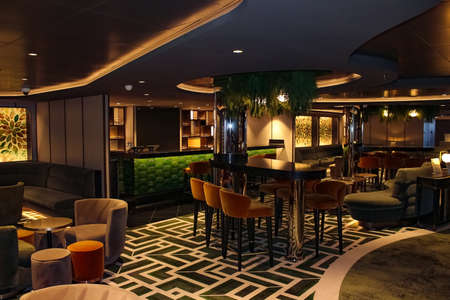 Miami, USA - April 29, 2022: Interior of the bar in the at new cruise ship or new flagship of MSC Seashore, the largest cruise ship built in Italy.のeditorial素材
