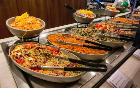 Dining Room Buffet aboard the abstract luxury cruise ship. selective focus. vegetable dishesの写真素材