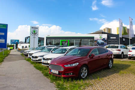Kosice, Slovakia - May 13, 2022: Company store building with an emblem of Skoda Auto, Czech automobile manufacturer. No people, cloudy sky.のeditorial素材