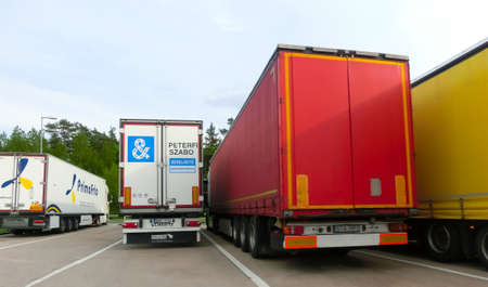 D-1 Truckpark, Czech - May 10, 2022: Trucks and Semi Trailer Trucks the Parking lot. Delivery...