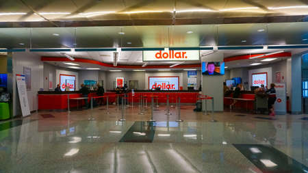 Miami, Florida, USA - November 29, 2019: The people near Dollar rental car office at Miami airport...