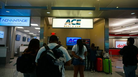 Miami, Florida, USA - April 28, 2022: The people near ACE rental car office at Miami airport at Miami, Florida, USA on April 28, 2018のeditorial素材