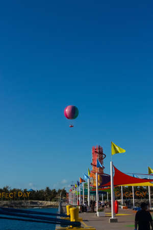 Coco Cay, Bahamas - April 29, 2022: People going to island from ship docked in Cococay, the private island post that's owned by the Royal Caribbean cruise line where guests can spend a day having fun.のeditorial素材