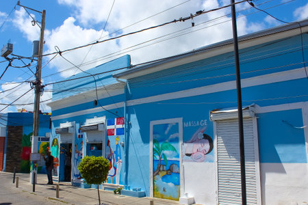 Puerto Plata, DR - May 04, 2022: Shops and painting near buildings in the center of Puerto Plata, Dominican Republicのeditorial素材