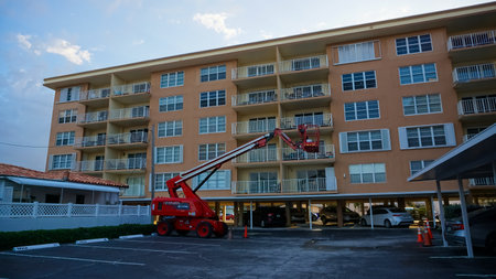 Lauderdale-by-the-Sea, USA - May 09, 2022: Bucket truck lift crane