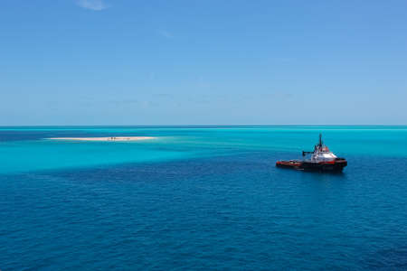 Puerto Plata, DR - January 10, 2022: Patrol boat sailing in bright blue Caribbean water